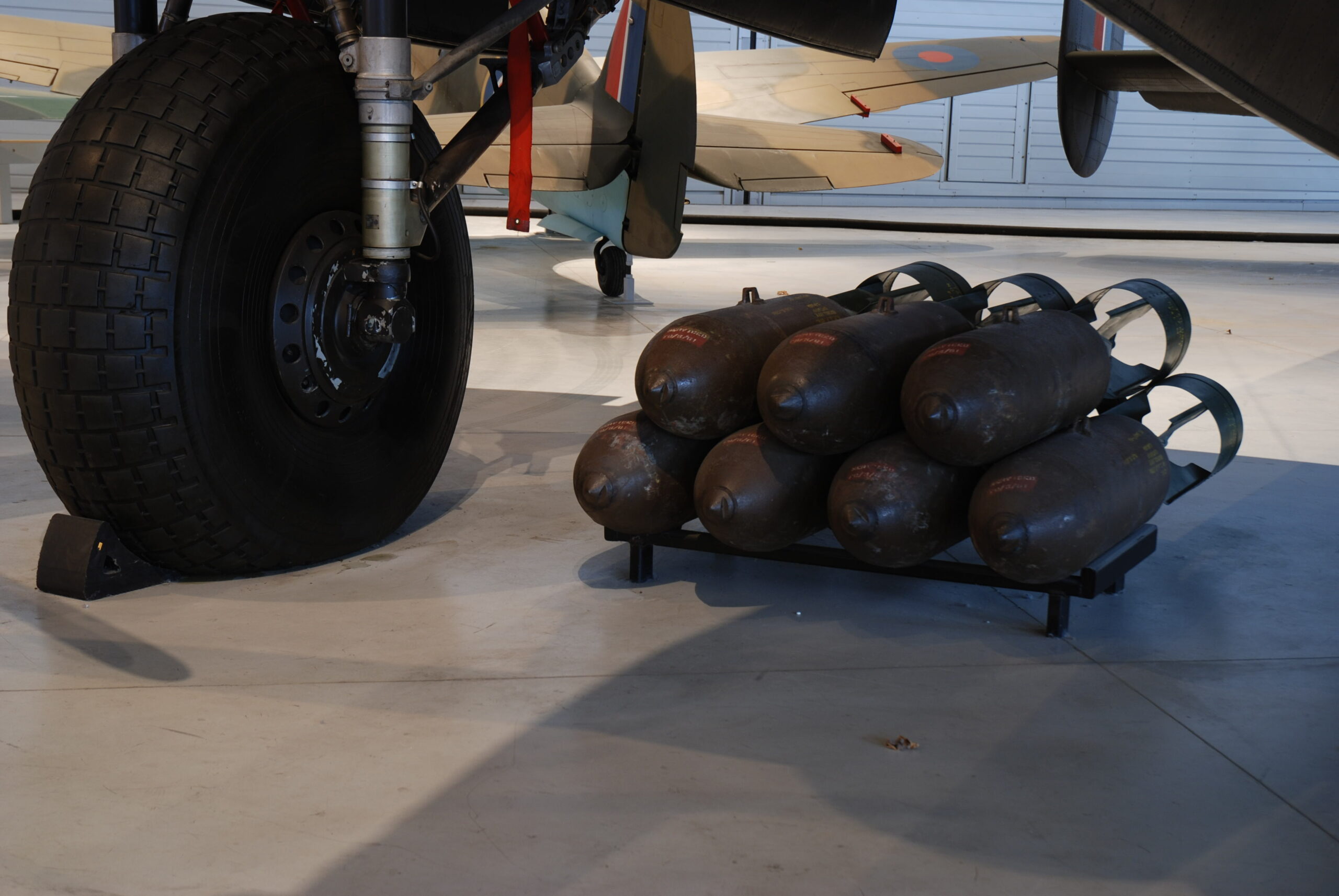 Lancaster bombs beside landing wheel